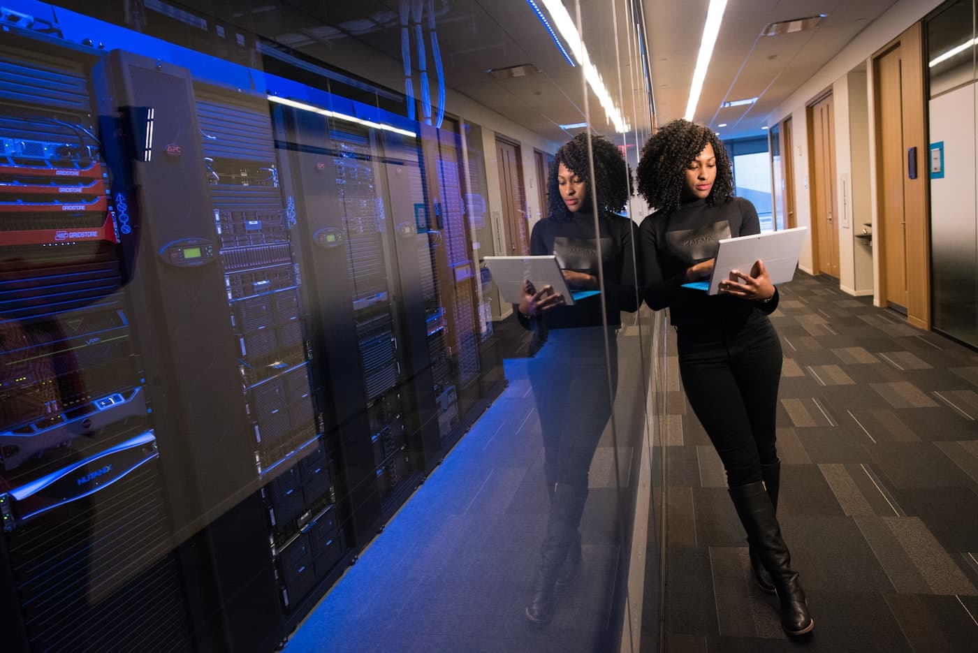 Specialist reviewing server infrastructure in a data centre
